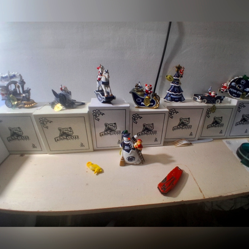 collection of Penn State-themed Christmas ornaments and figurines.